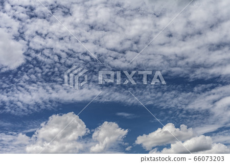 Bright summer day with cirrus and cumulus clouds 66073203