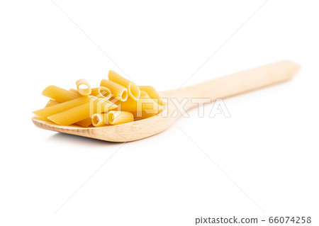 Uncooked penne pasta. Dried italian pasta in 66074258