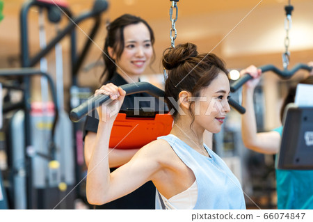 Young woman, trainer, gym 66074847