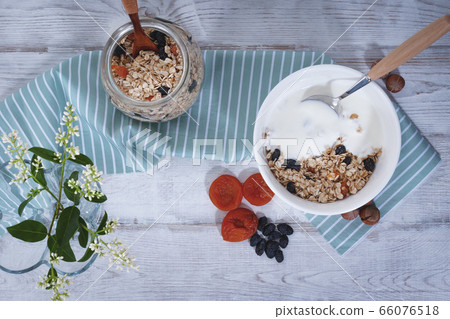 Granola with fruit and yogurt Granola with fruit and yogurt 66076518