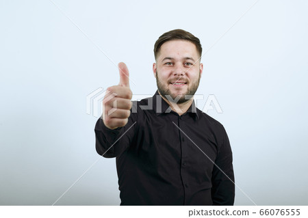 Happy Male Smiles Presented Thumb Finger Up. The Concept Of Successful 66076555