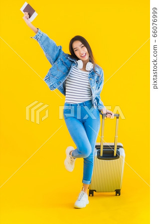 Portrait beautiful young asian woman travel and leisure with luggage bag and passport Portrait beautiful young asian woman travel and leisure with luggage bag and passport 66076999