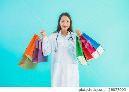 Portrait beautiful young asian doctor woman with colorful shopping bag Portrait beautiful young asian doctor woman with colorful shopping bag 66077003