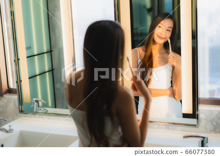 Portrait beautiful young asian woman with container cardboard parcel box Portrait beautiful young asian woman with container cardboard parcel box 66077380