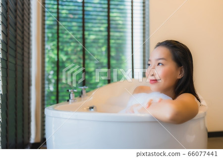 Portrait beautiful young asian woman with container cardboard parcel box 66077441