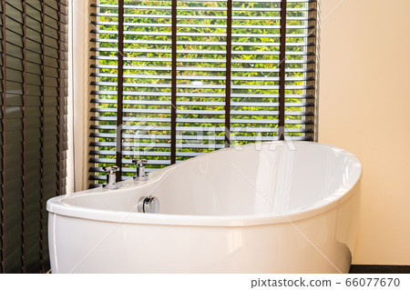 White bathtub and jacuzzi decoration interior 66077670