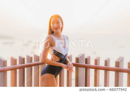 Beautiful young asian woman use smart mobile phone 66077942