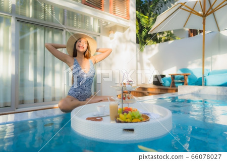 Portrait beautiful young asian woman use alcohol spray for clean Portrait beautiful young asian woman use alcohol spray for clean 66078027