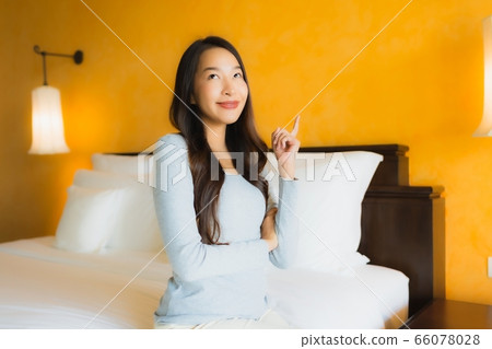 Portrait beautiful young asian woman use alcohol spray for clean Portrait beautiful young asian woman use alcohol spray for clean 66078028