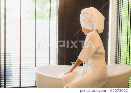 Portrait beautiful young asian woman happy smile relax take a bath in bathtub Portrait beautiful young asian woman happy smile relax take a bath in bathtub 66078062