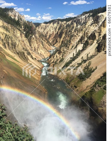 Rainbow and waterfall 66079381