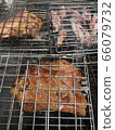 Squid and pork necks grilling on a charcoal grill Grilling is popular among Thais for parties to add fun and hilarity. 66079732