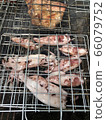 Squid and pork necks grilling on a charcoal grill Grilling is popular among Thais for parties to add fun and hilarity. 66079752