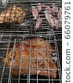 Squid and pork necks grilling on a charcoal grill Grilling is popular among Thais for parties to add fun and hilarity. 66079761
