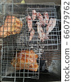 Squid and pork necks grilling on a charcoal grill Grilling is popular among Thais for parties to add fun and hilarity. 66079762