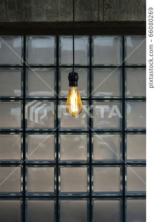 Vintage hanging light bulbs on the dark glass Vintage hanging light bulbs on the dark glass 66080269