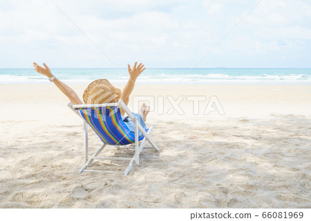 Young Beautiful Asian woman relax with chairs on Young Beautiful Asian woman relax with chairs on 66081969