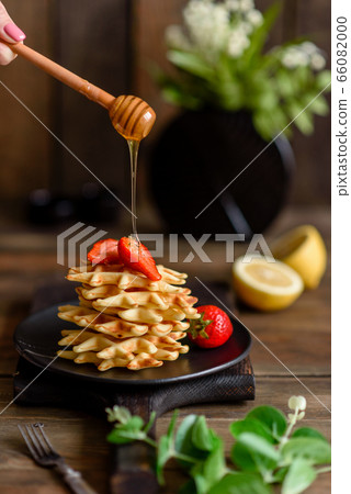 Delicious fresh baked belgian waffles with berries 66082000