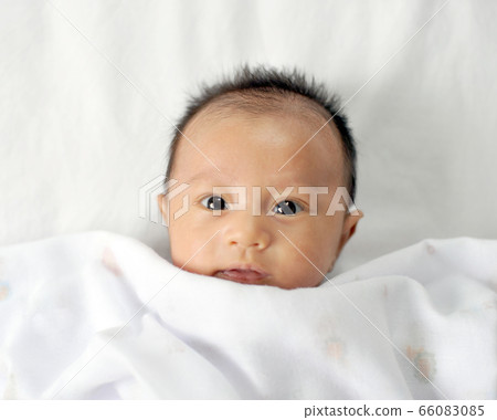 Adorable baby boy in bedroom. Newborn child Adorable baby boy in bedroom. Newborn child 66083085