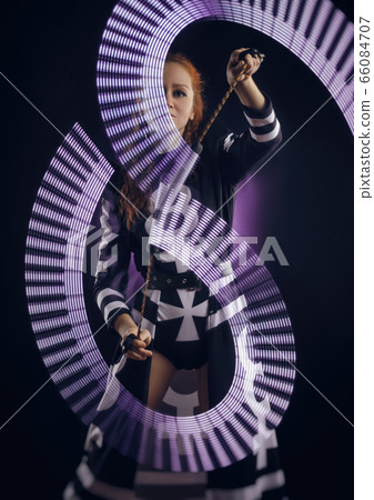 girl dancing light show 66084707