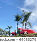 California ros palm trees red car retro car blue sky 66086279