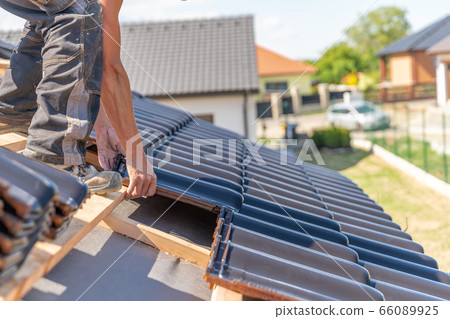 production of roofs from ceramic fired tiles on a family house production of roofs from ceramic fired tiles on a family house 66089925