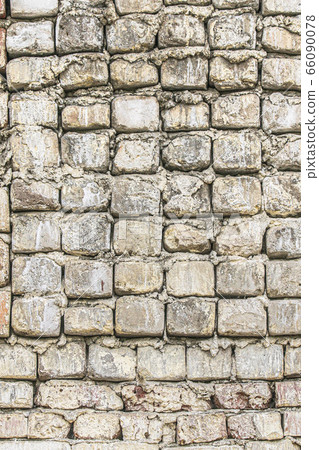 Aged brick wallBackground of the old ruined white brick wall 66090078