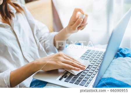 People alcohol spray laptop keyboard cleaning for personal hygiene and cleanliness People alcohol spray laptop keyboard cleaning for personal hygiene and cleanliness 66090955