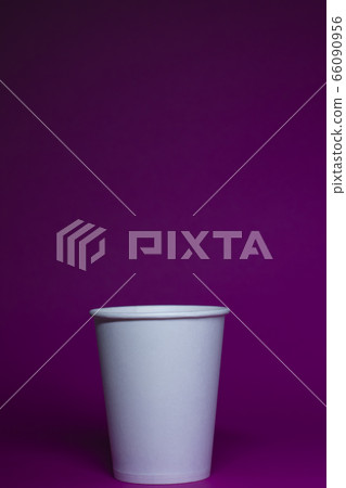 An empty white paper cup on a pink background An empty white paper cup on a pink background 66090956