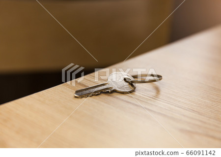 Keys on the ring on table in a room Keys on the ring on table in a room 66091142