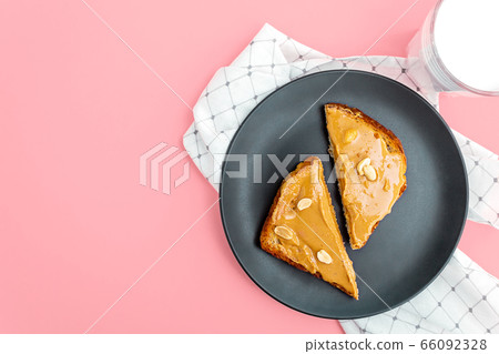 Top view. Peanut butter toasts on plate. Top view. Peanut butter toasts on plate. 66092328