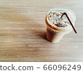 Iced coffee on wooden table 66096249