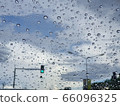 Dark sky raining with water drops 66096325