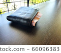 Thai money in wallet on table 66096383