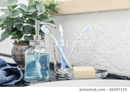Bathroom set with toothbrushes, towels and soap Bathroom set with toothbrushes, towels and soap 66097138