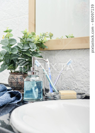 Bathroom set with toothbrushes, towels and soap Bathroom set with toothbrushes, towels and soap 66097139