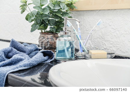 Bathroom set with toothbrushes, towels and soap 66097140