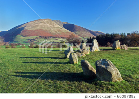 Castlerigg Stone Circle.  Castlerigg Stone Circle is situated near Keswick, Cumbria in the English Lake District national park.  Blencathra, one of the highest peaks in Cumbria, is in the background. 66097892