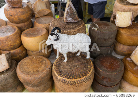 Various traditional Italian cheese on a market stand 66098269