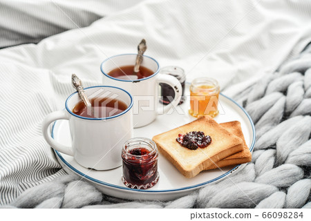 Tray with two cups of black tea Tray with two cups of black tea 66098284