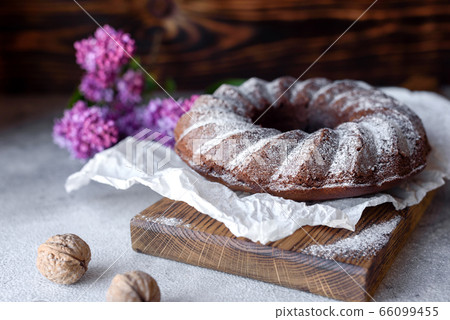 Round chocolate coffee cupcake with raisins Round chocolate coffee cupcake with raisins 66099455