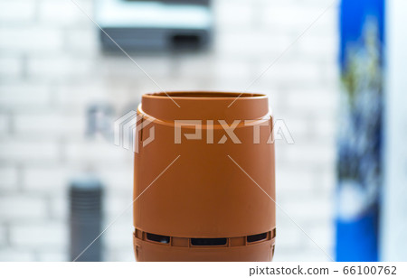 Detail of a chimney on wooden home. Chimney with two steel pipes. Roof and chimney of family house. 66100762