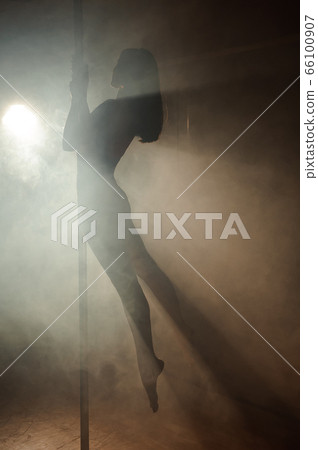 young slim female body near the pole. young slim female body near the pole. 66100907