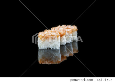 Close Up Of Sushi Roll On A Black Background . Japanese dish . Close Up Of Sushi Roll On A Black Background . Japanese dish . 66101392