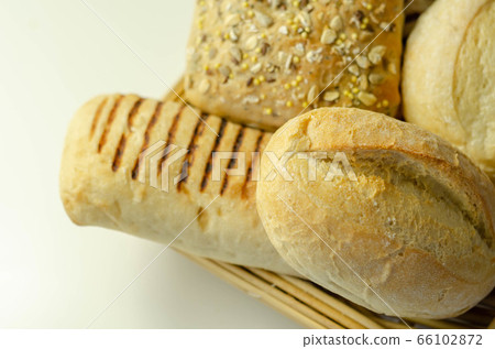 Various types of bread served on a wicker tray, Various types of bread served on a wicker tray, 66102872