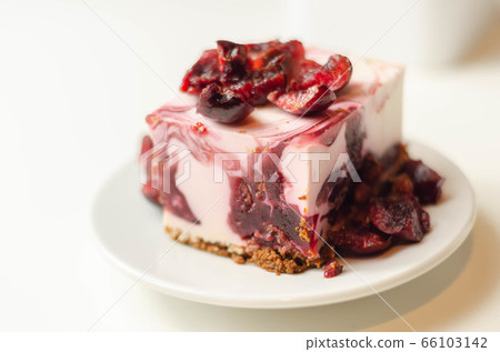 Japanese cheesecake with cherry sauce and fresh 66103142