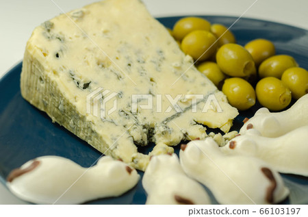Full fat soft blue veined cheese with olives and 66103197