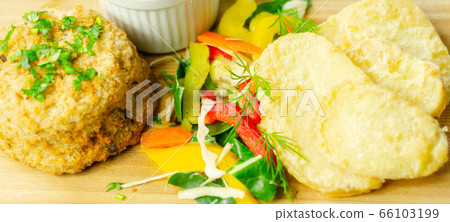 Smoked haddock fishcake with slices fried potatoes 66103199