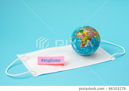 Coronovirus prevention, mask and globe, stay home on light blue background 66103276