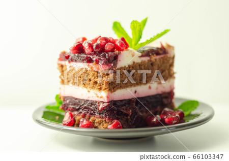Colorful multi-layered cream chocolate cake with 66103347